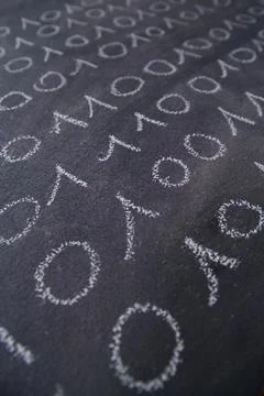Graphical representation with chalk on the blackboard binary digital code 写真素材