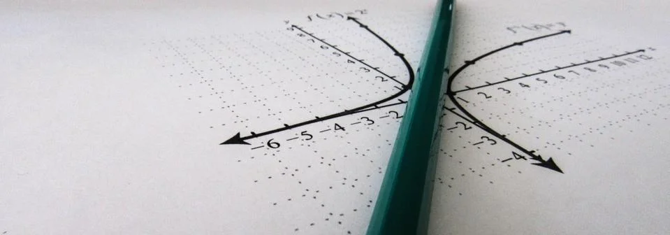 Graphical representation of math functions and a pencil Stock Photos