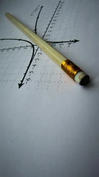 Graphical representation of math functions and a pencil Stock Photos