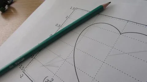 Graphical representation of math functions and a pencil Stock Photos