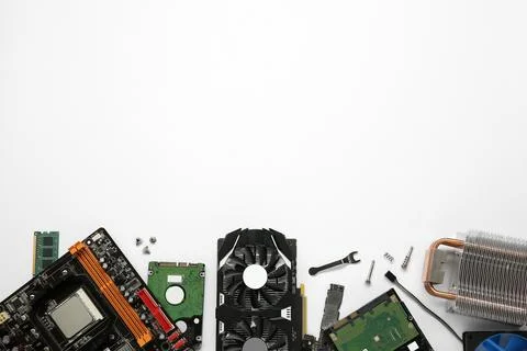 Graphics card and other computer hardware on white background, flat lay. Sp.. Stock Photos