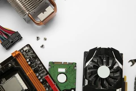 Graphics card and other computer hardware on white background, flat lay. Sp.. Stock Photos