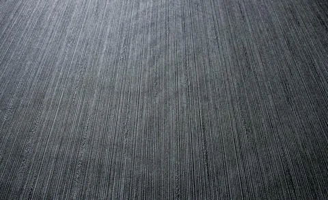 Graphite background. The texture is decorative with a strip. Stock Photos