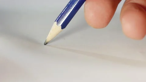 Graphite pencil draws a straight line on a white background paper, macro shot. Stock Footage 143556744
