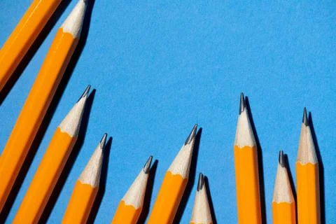 Graphite pencils on a blue background macro photo, school and office supplies Foto stock