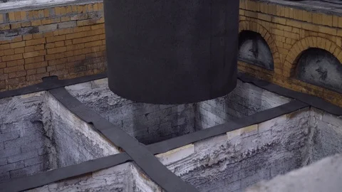 Graphite rod is lowered into one of the cells of the refrigerating chamber Stock Footage 115927736