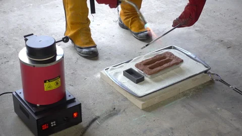 Graphite stir rod is heated with a MAP gas torch. Stock Footage 331274764
