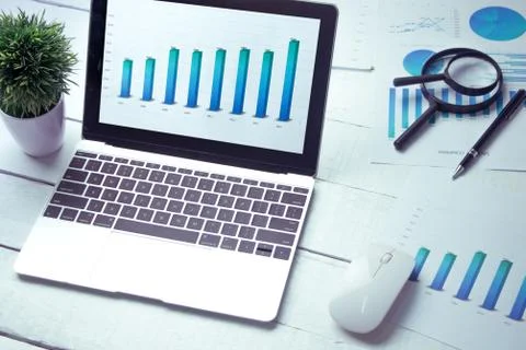 Graphs and charts elements on laptop computer screen  and statistical perform Stock Photos