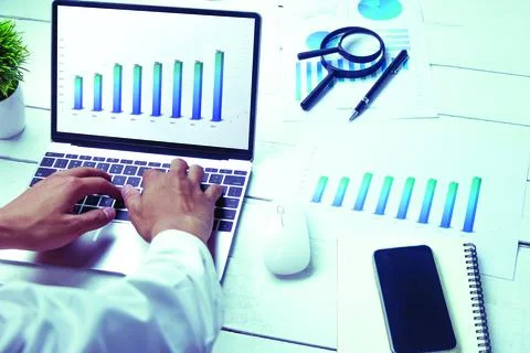 Graphs and charts elements on laptop computer screen  and statistical perform Stock Photos
