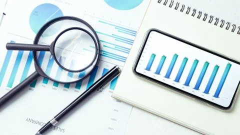 Graphs and charts elements on phone screen  and statistical performance of th Stock Photos