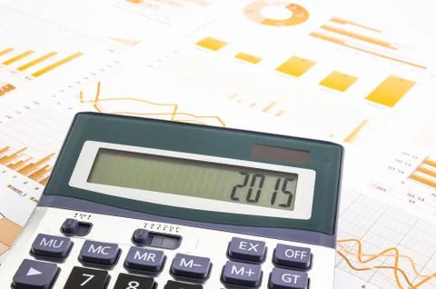 Graphs background with 2015 number on calculator Stock Photos