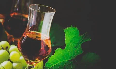 Grappa, grape vodka, selective focus and toned image Stock Photos