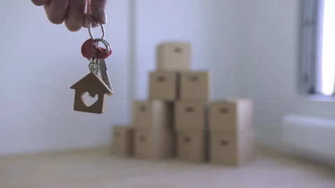 Grasping the keys to the house in the void. Stock Footage 313679629