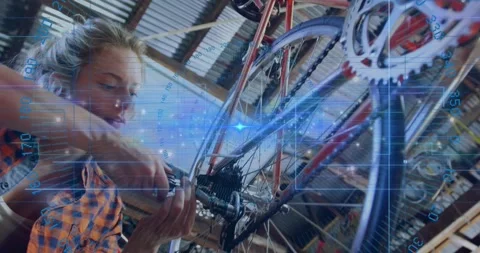 Grasping wrench on bicycle cassette lockring, woman loosening and aligning gears Stock Footage 320287216