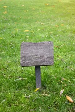 Grass and plaque. Stock Photos
