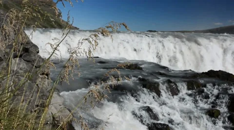 Grass and rocks with Gullfoss waterfall as a background, Iceland Stock Footage 33795322