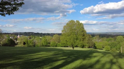 Grass area overlooking a town Stock Footage 158817423
