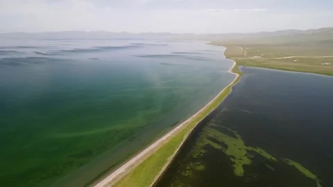 Grass-Covered Spit in Lake Son-Kul Stock-Footage 314464279