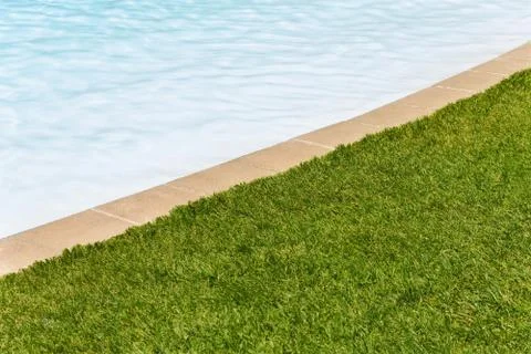 Grass edge swimming pool background Stock Photos