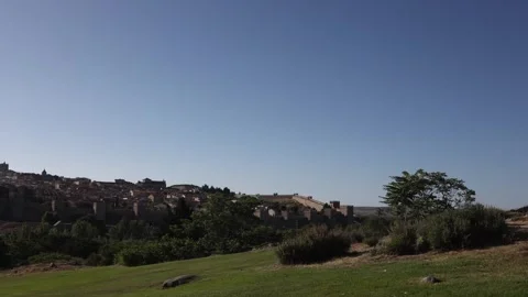 Grass field and view of the town and Walls of Avila. Spain. Stock Footage 268851245