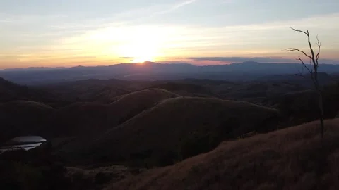 Grass Field Over The Mountain Evening Sunset in Thailand Stock Footage 146513293