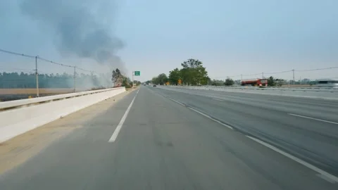 Grass fire. Big Flame near highway burn bushes and electric wires. Destruction Stock Footage 138236268
