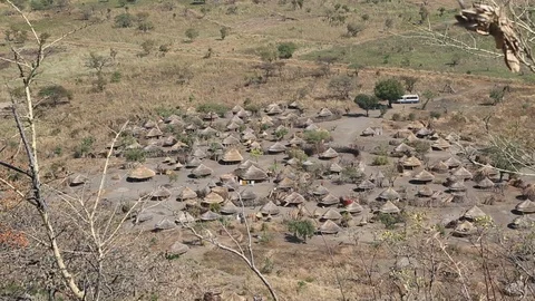 Grass Huts Make Up Small Village In Remote Africa High Angle Stock-Footage 102153671