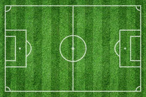 Grass soccer field with white pattern lines. Top view sport background. Stock Photos