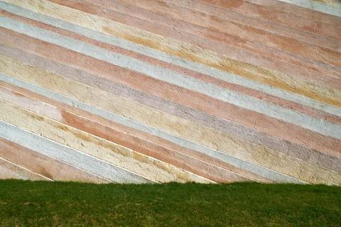 Grass with a stone wall Stock Photos