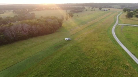 Grass Strip at the Ranch Vtail Depart to the north, left turnout, sunset Stock Footage 313362256