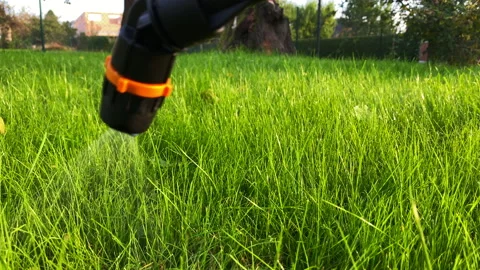 Grass watering with spray pumping machine 库存影片 164916079