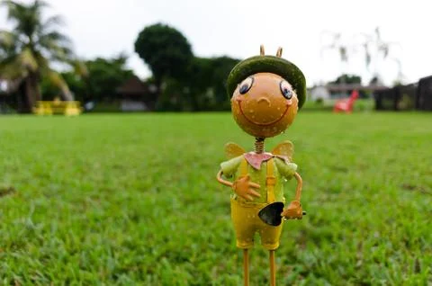 Grasshopper with shovel in grass Stock Photos