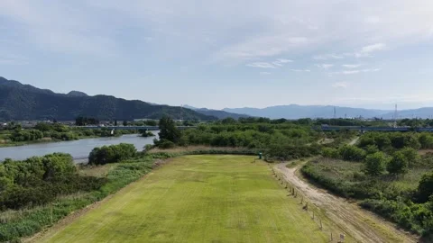Grassland River Bridge and Mountains in Nagano Japan Stock Footage 336617067