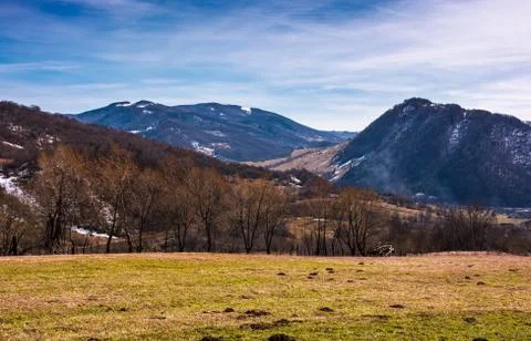 Grassy field on an slope in springtime Stock Photos