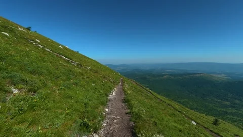 Grassy hillside leads downward to valley below. Mount Rtanj, Serbia Stock-Footage 342314982