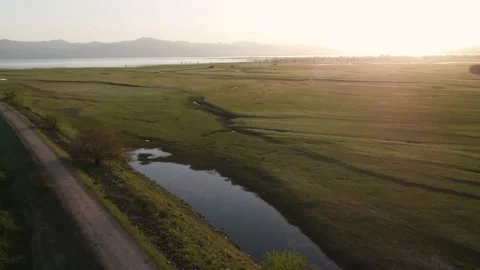 Grassy Lake Fields Aerial Crane Shot 스톡 동영상 192055896