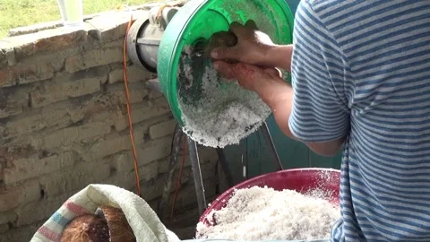 Grate coconut with a grater machine Stock Footage 199025848