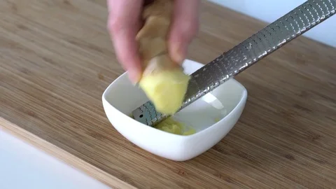 Grate fresh ginger root Stock Footage 73275594