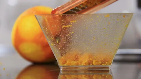 Grate the peel of an orange: cook a typical Italian dessert Stock Footage 61357074