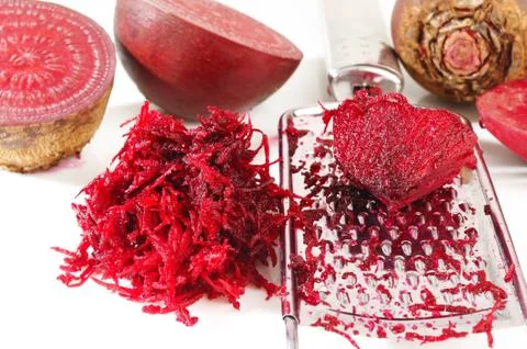 Grated beets on a white background Stock Photos