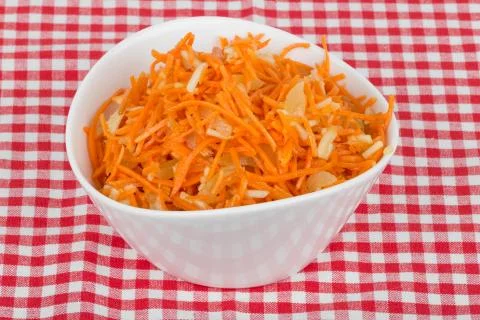 Grated carrot with pineapple on the tablecloth Stock Photos