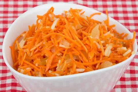 Grated carrot with pineapple on the tablecloth Stock Photos