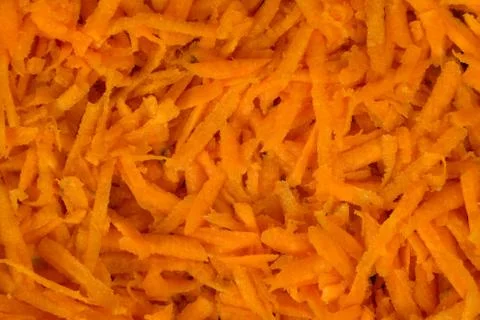 Grated carrots as a background Stock Photos