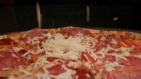 Grated Cheese Falling on Pepperoni Pizza Macro Dolly Shot Vídeos de archivo 292632245