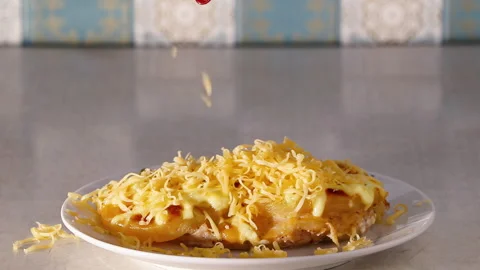Grated cheese falls on baked meat dish. Stock Footage 270095540
