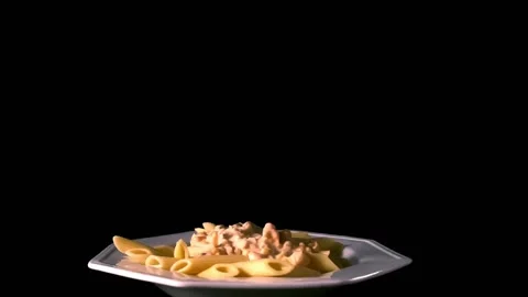 Grated cheese falls on pasta, black background Stock Footage 233372238