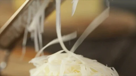 Grated Cheese forms Pile of Cheese Closeup Stock Footage 99198296