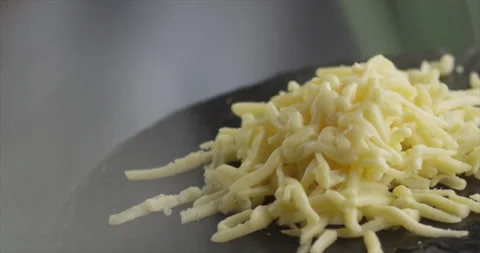 Grated cheese melts in timelapse Stock Footage 200255629