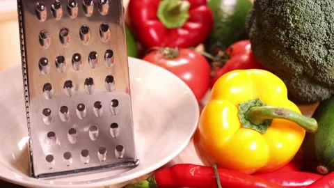 Grated cheese on a table full of vegetables. Stock Footage 144023553