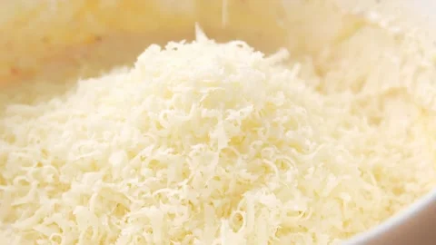 Grated Cheese Texture Close-up. Stock Footage 255745898